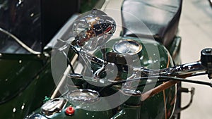 Close up of green motorcycle steering wheel