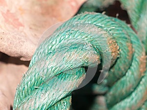 Close up of green rope in dock yard