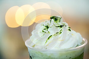 Close up green tea frappe with light bokeh background