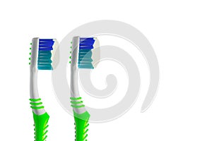 Close up green toothbrush with white creamy toothpaste isolated on white. photo
