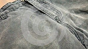 Close up of grey denim jeans close up with zipper