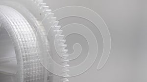 Close up of grey plastic cogwheel, copy space
