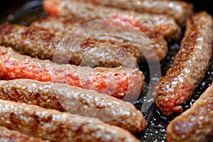 Close up grilled homemade meat sausages. Shallow depth a field.