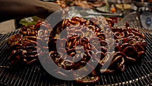 Close up of Grilled intestines on the grill. Street food