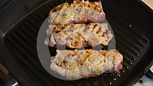 Close up grilled meat filled with cheese and ham on a pan. Cooking fresh meat. Gurman`s dish