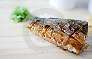 Close up of grilled Saba is on the wood table in the kitchen