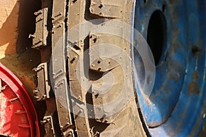 Close-up of a gripper from front wheel of a tractor. Replacing tractor tyres