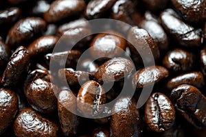 Close up of group black coffee beans. Strong black espresso, Grains of coffee background, texture