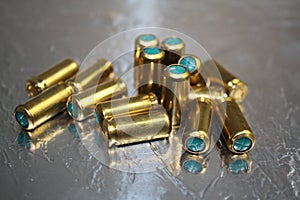 Close up group of blind bullet munition on silver shiny surface desk photo