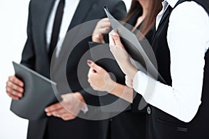 Close up.group of business people with clipboards.isolated on white