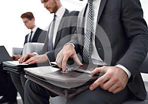 Close up.a group of business people sitting in the office waiting room