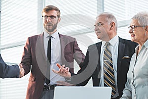 Close up. group of business people standing in the office