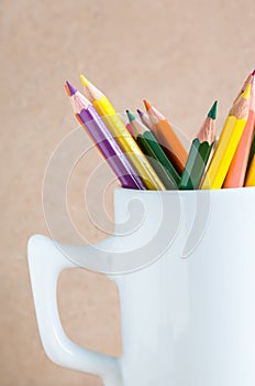 Close-up A group of color pencils in a white cup