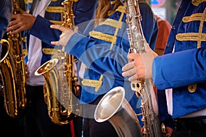 Close-up of a group of saxophonists in the foreground