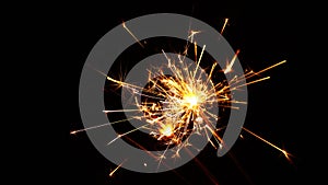 Close up several firework sparklers over black