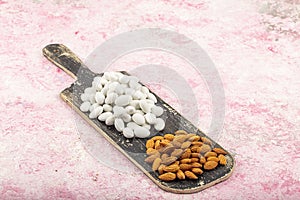 Close up of a group of white sugared almonds. Almond candies. Candies background top view, almond sweets. Sugar Feast, Feast of