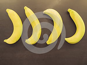 close up group of yellow banana ingredient of asia healthcare food on wood background