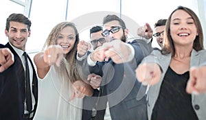 Close up.a group of young business people pointing at you