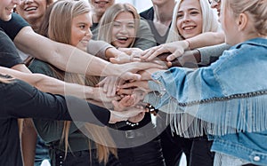 close up. a group of young people showing their unity.