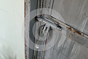 Close up:grunge metal old rusty door hinge,.