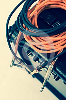 Close-up of guitar amplifier with jack cable