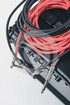 Close-up of guitar amplifier with jack cable