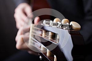 Close up of an guitar being played.