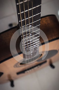 Close up of guitar and fret board