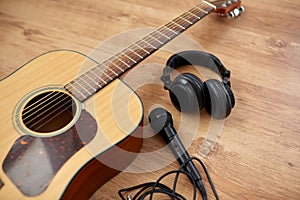 close up of guitar, microphone and headphones