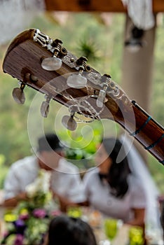 Close up on guitar tuning knobs at marriage photo