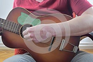 Close up of guitarist hand playing acoustic guitar. Musical concept