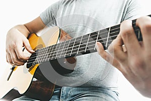 Close-up of guitarist hand playing on classical guitar