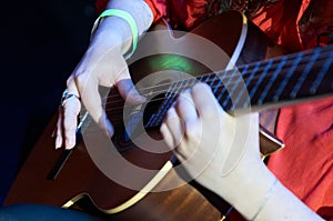 Close up of a guitarist's skilled hands