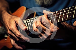 close-up of guitarists fingers on the fretboard