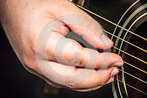 Close up of guitarists hand