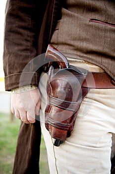 Close up of gun in a old western holster photo