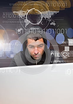 Close up of hacker using a laptop behind a digital screen
