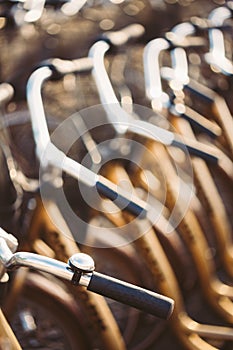 Close Up Of Hadlebars Of Parked Bicycles Bikes For Rent