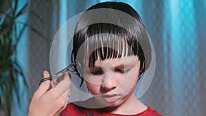 Close-up of hair cutting on the boy head.