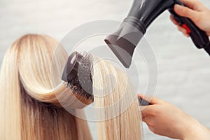 Close-up of hair dryer, concept cut salon, female stylist photo