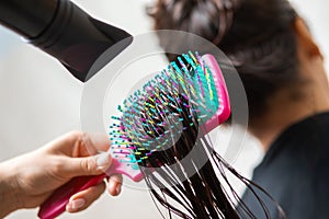 Close-up of hair dryer, concept cut salon, female stylist