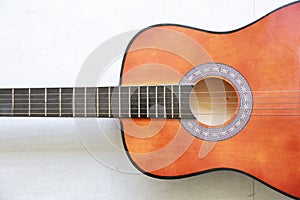 Close up half acoustic guitar on white background with right free space