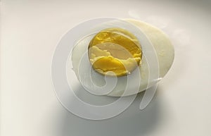 Close up a half of boiled egg on the white background
