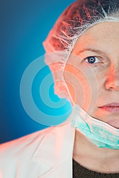 Close up half face portrait of female dentist specialist