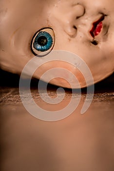 Close up of old neglected and unloved plastic doll .