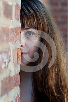 Close-up half face portrait of young redhead