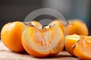 Close up of half and slice persimmon fruit