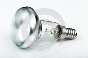 Close up of a halogen light bulb from the side