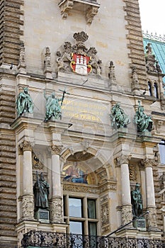 Close up of Hamburg town hall front exterior in summer at market square with Latin inscription