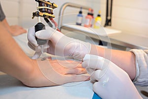 close up hand being tattoo